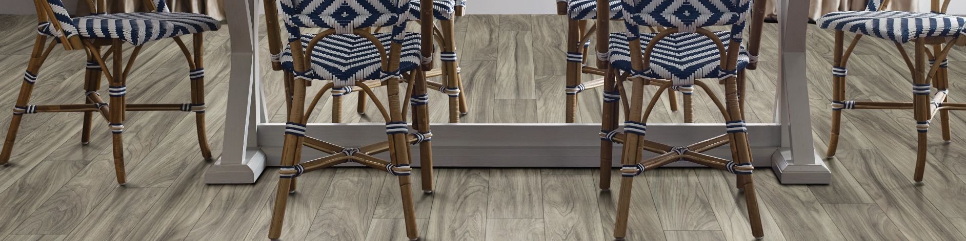 woven dining chairs around a dining table - Dishman Flooring Center