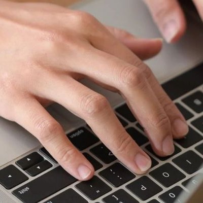 Someone is typing on a computer from Dishman Flooring on Houma, LA area